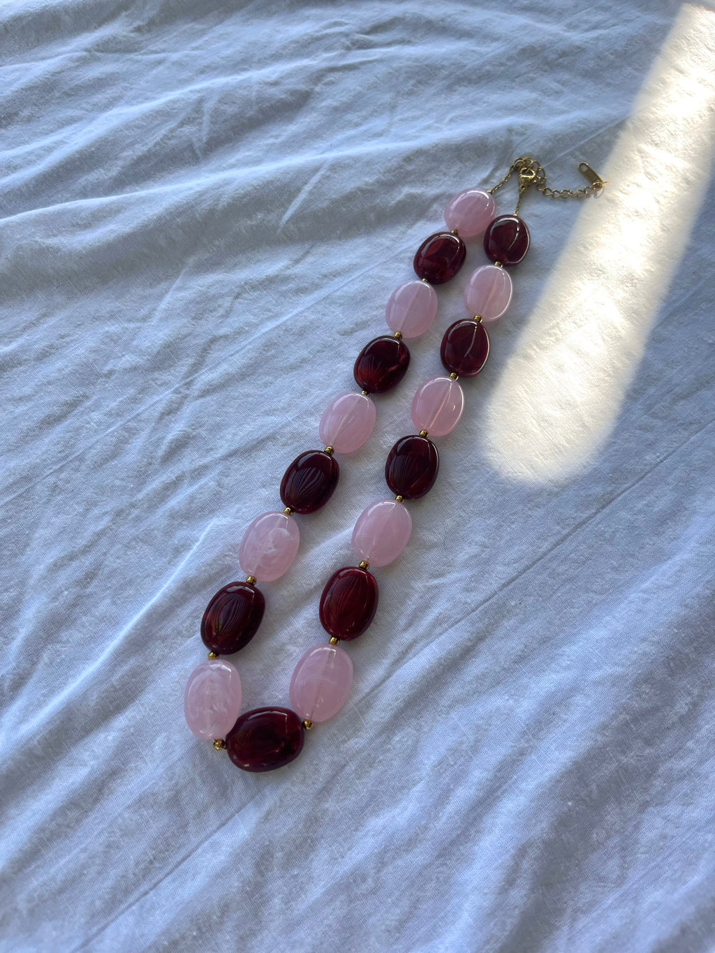Rood/Roze kralen ketting